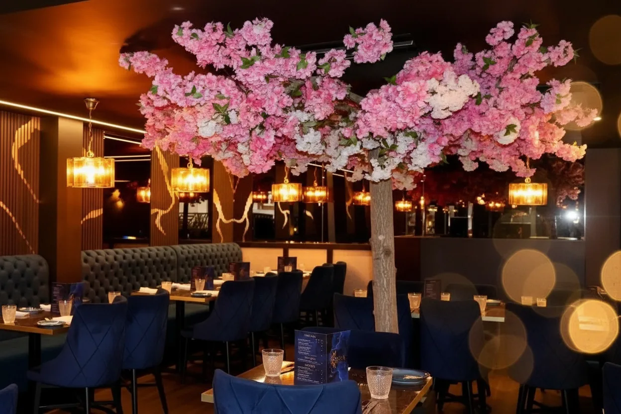 Brass pendant lights and blossom at Qissa
